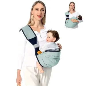 Parent wearing a baby in a soft sling carrier on one shoulder.